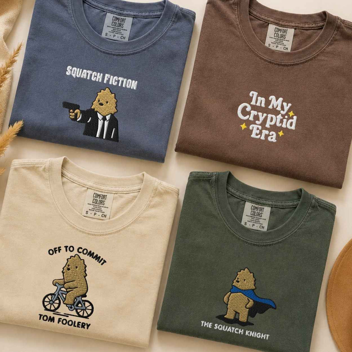 Collection of bigfoot tshirts with designs like squatch fiction, in my cryptid era, off to commit tom foolery and the squatch knight